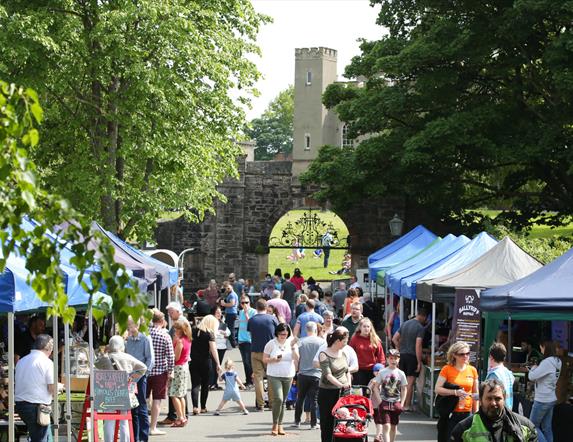 Stall Holders and Customers on the Dark Walk leading to the fort