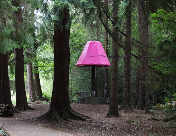 The Lamp sculpture through the trees in Hillsborough Forest Park