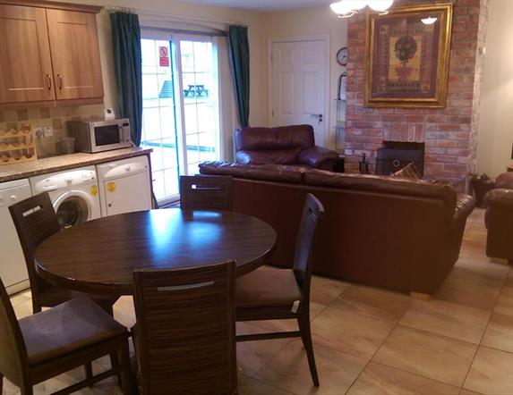 Image shows image of kitchen, diner and lounge space