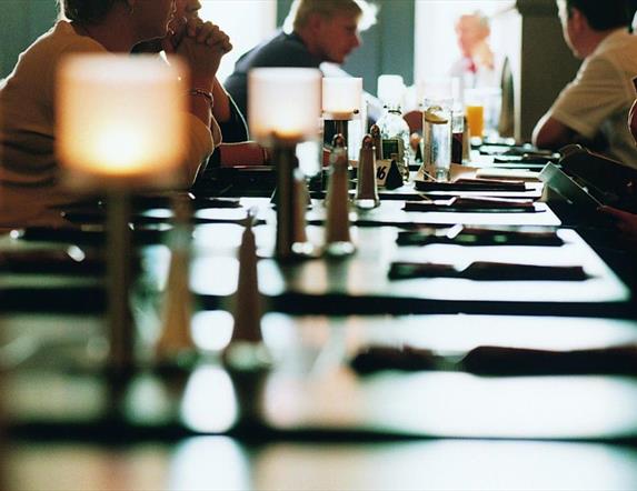 Image shows tables and diners in restaurant