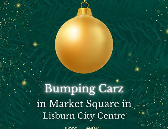 Image is of gold bauble on a Christmas tree