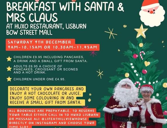 Image is Santa Claus and Mrs Claus ready for breakfast at HUXO restaurant