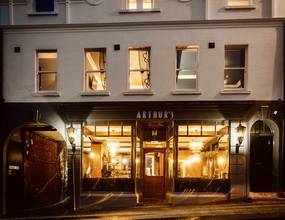 An image of the exterior of Arthur's in the evening