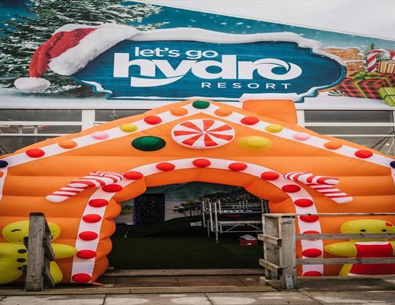 Image is of an inflatable decorated for Christmas