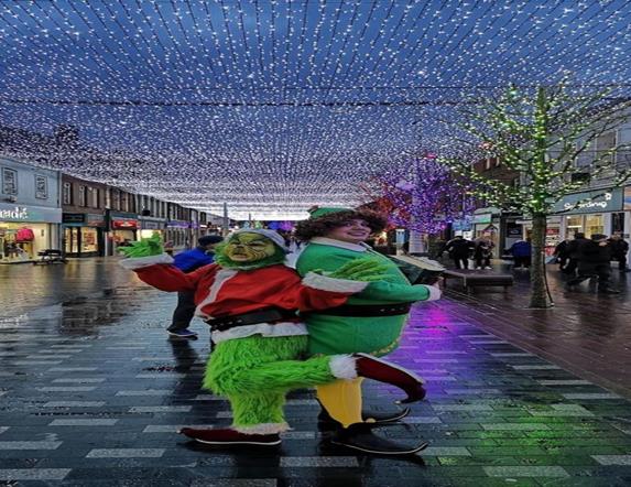 Image is of Christmas characters doing a walk about in Lisburn city centre