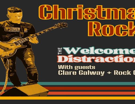 Image is of musician playing an electric guitar on stage