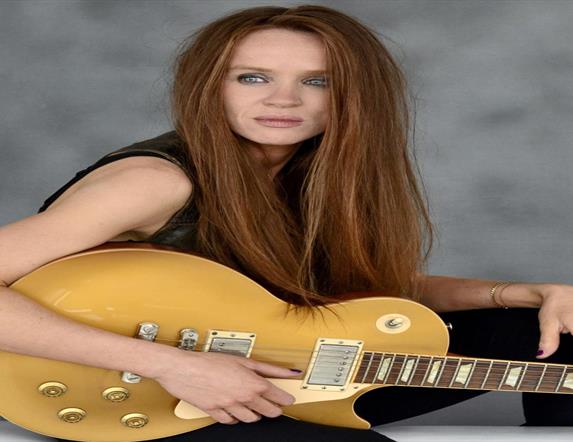 Image is of musician Grainne Duffy with her guitar