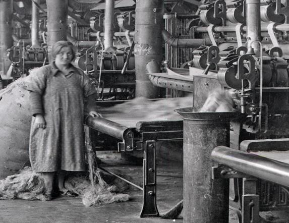 Image is black and white photograph of women working in the Belfast Mills
