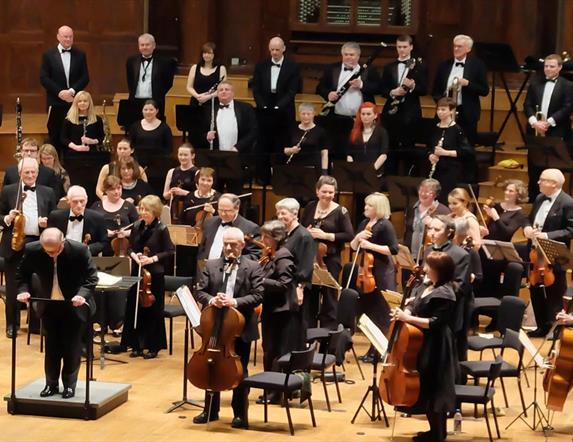 Image is members of the Studio Symphony Orchestra on stage