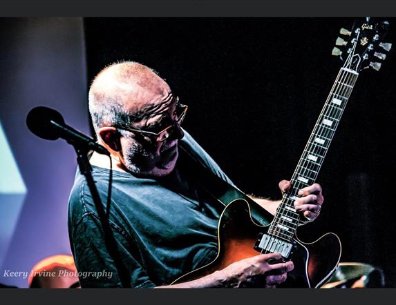 Picture of Ronnie Greer playing his guitar