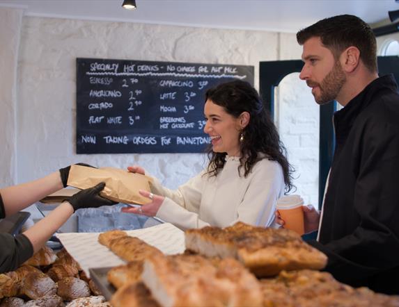 Couple at counter in Roundhouse Bakery