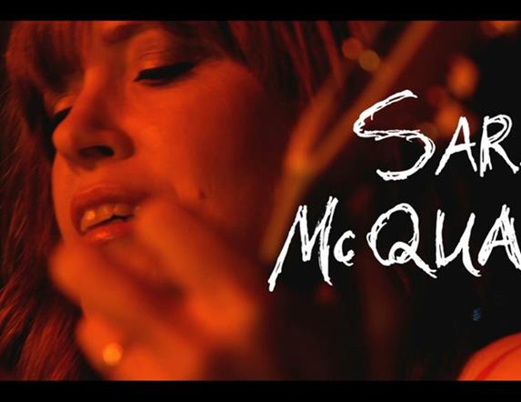 Image is of the singer Sarah McQuaid
