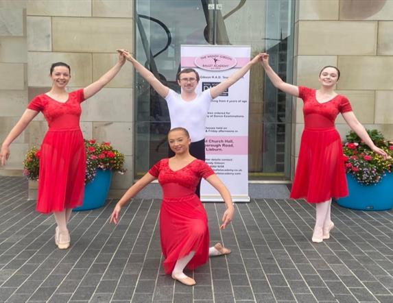 Image shows 4 members of The Wendy Gibson Ballet Academy at the front of the Lisburn Visitor Information Centre, Market Square Lisburn.