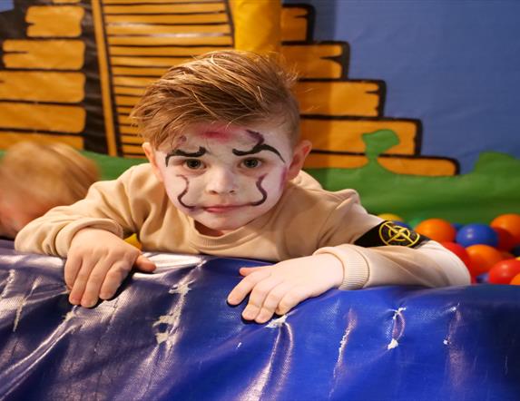 Image shows child with facepaint and Halloween costume at Indiana Land