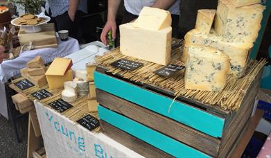 Image shows a stall showing a selection of cheese