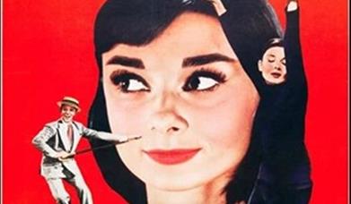 Image shows red background with picture of Audrey Hepburn and smaller images on either side