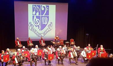 Baillies Mills Accordion Band on stage at ISLAND Arts Centre