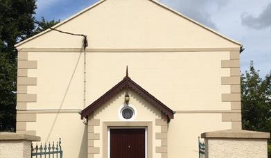 Outside image of the church showing gateway