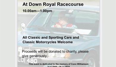 Image is of a man driving a car