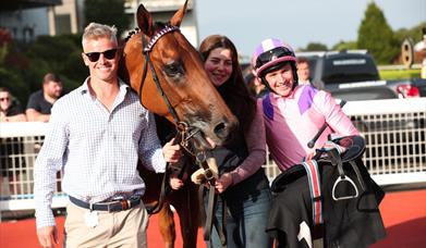 Picture of horse with owner and rider