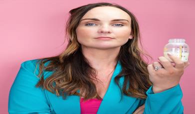 Picture of artist with a pink background