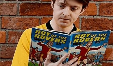 Picture of a man reading a book