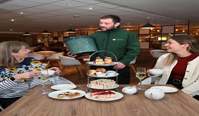 Image is of customers enjoying afternoon tea at Dobbies Lisburn