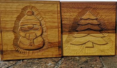 Image is of Christmas wood carvings