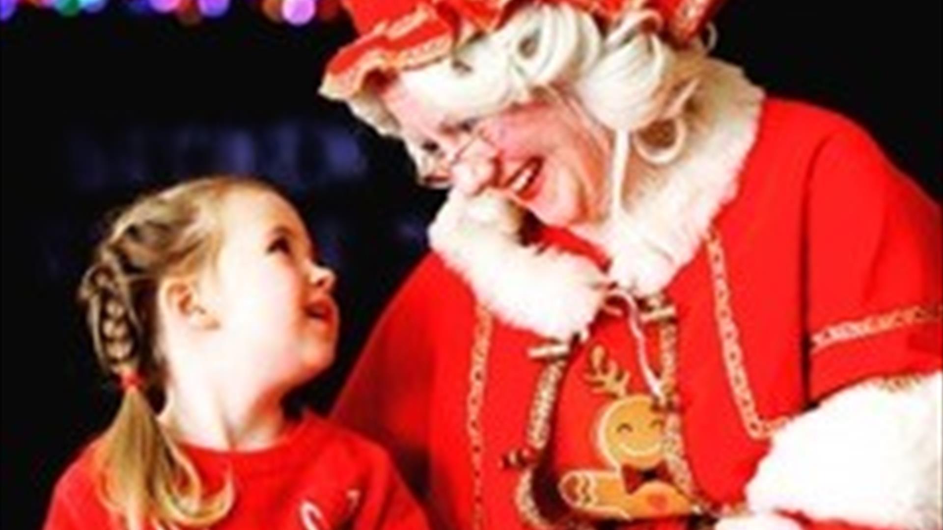 Image is of Mrs Claus and child