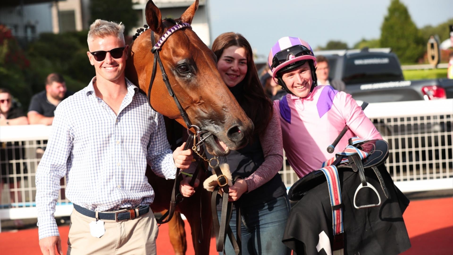 Race Horse and Jockey wearing pink