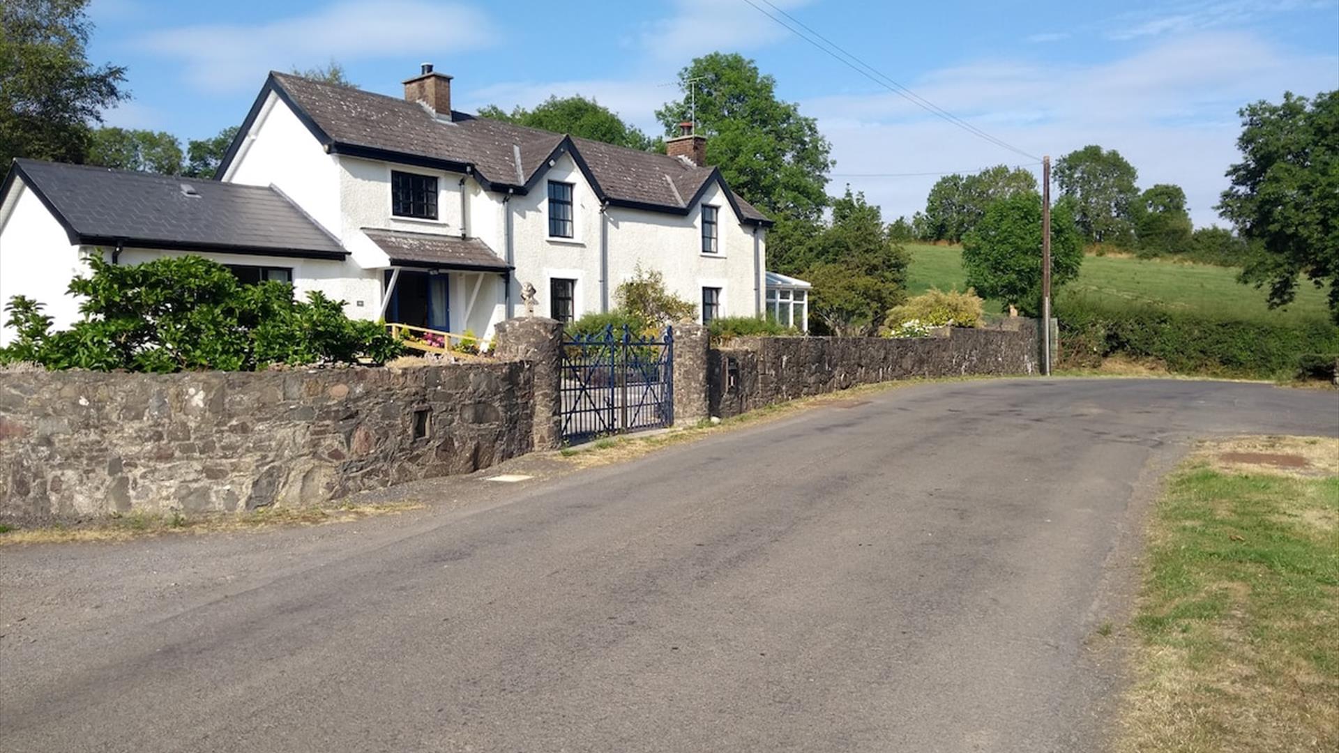 Image shows front of property facing onto country road