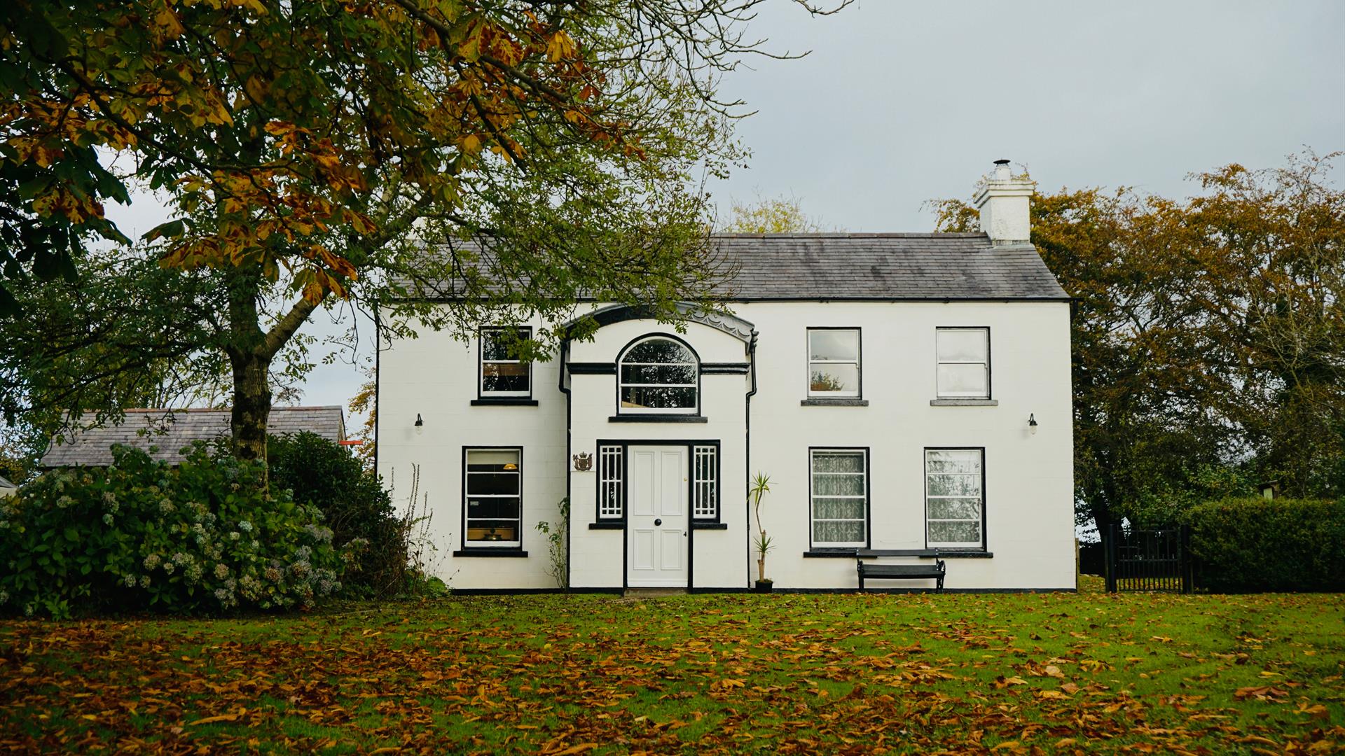 The front view of the house at Autumn time
