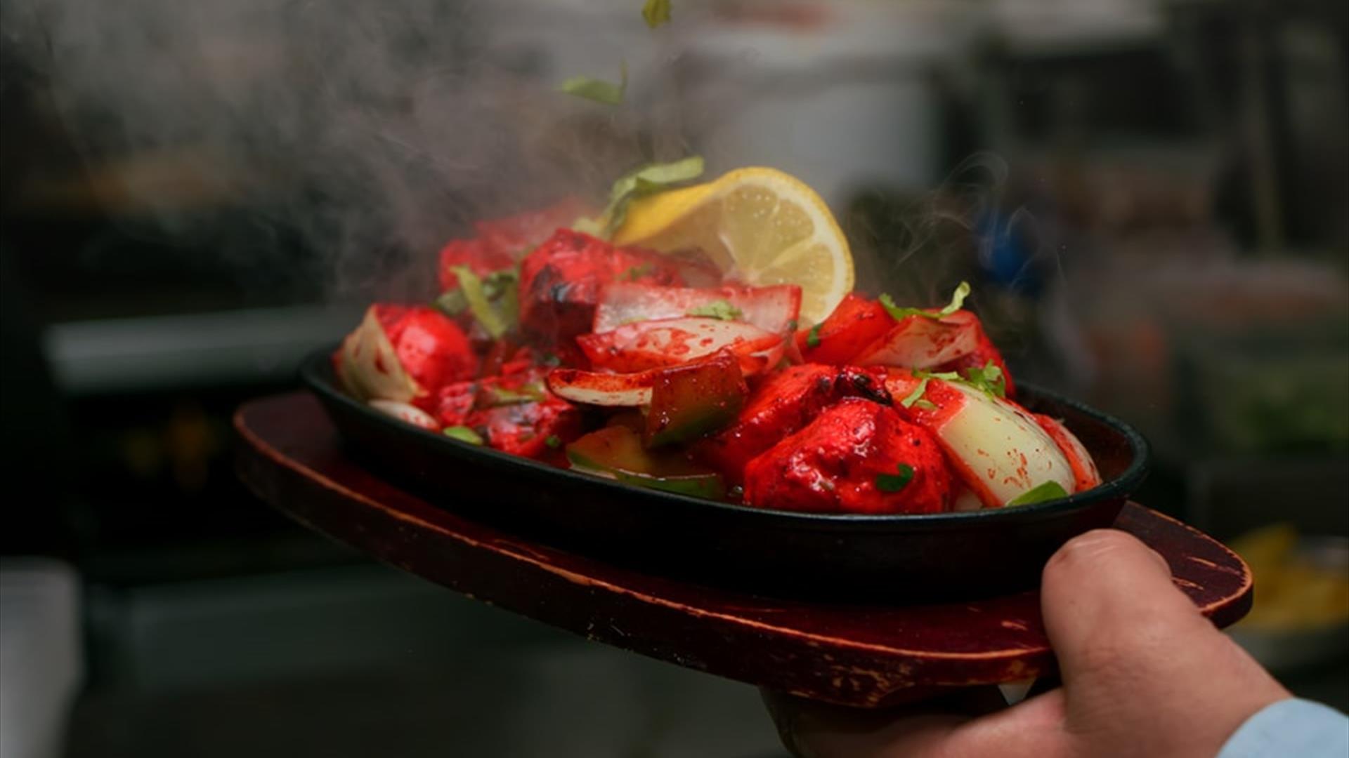 Image is of Indian food being served