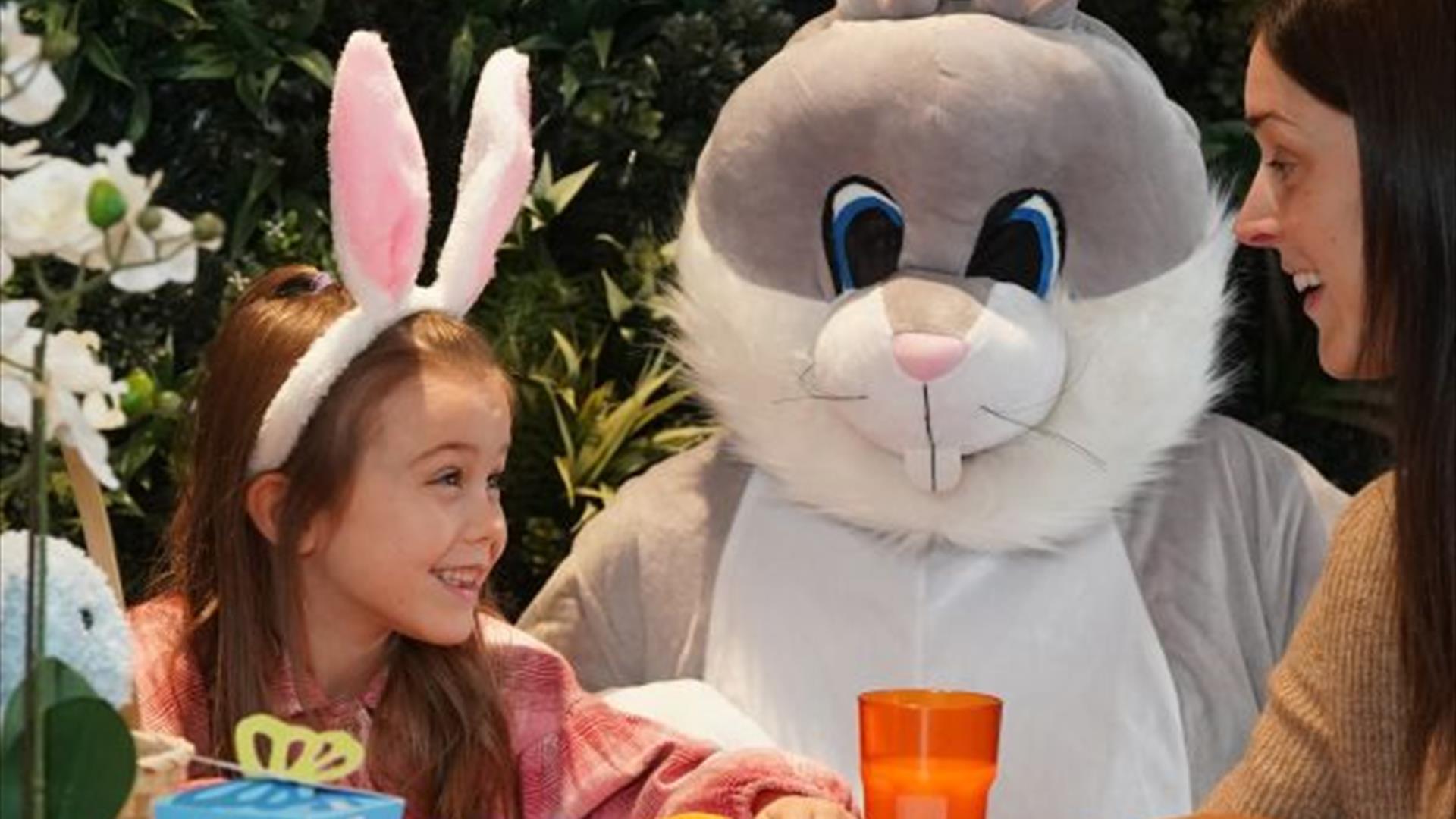 Easter Bunny with little girl and woman.