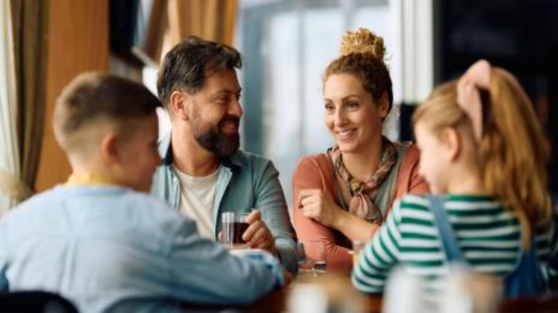 Inage shows Father, Mother and two children dining in the La Mon Hotel on Father's Day.