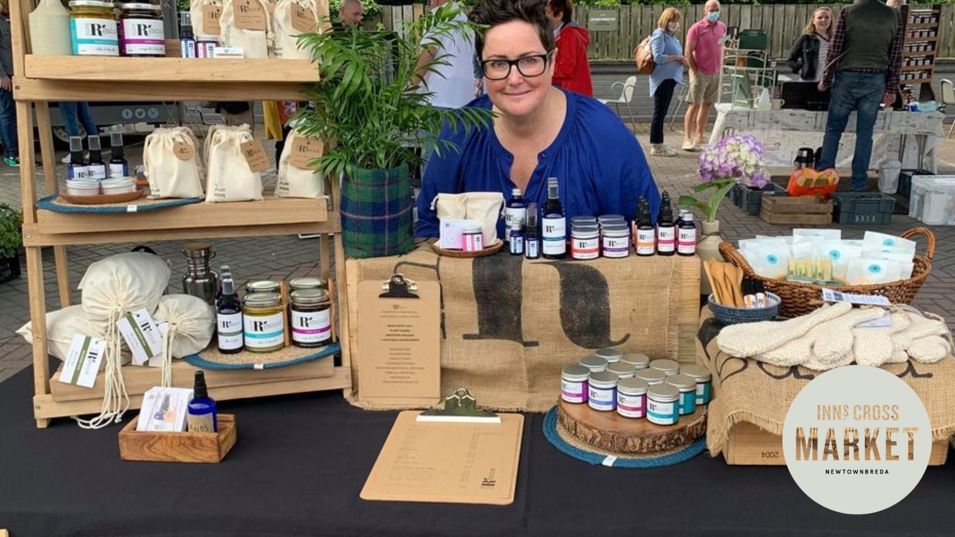 Image is of a trader at her stall at Inns Cross Market Newtownbreda Belfast