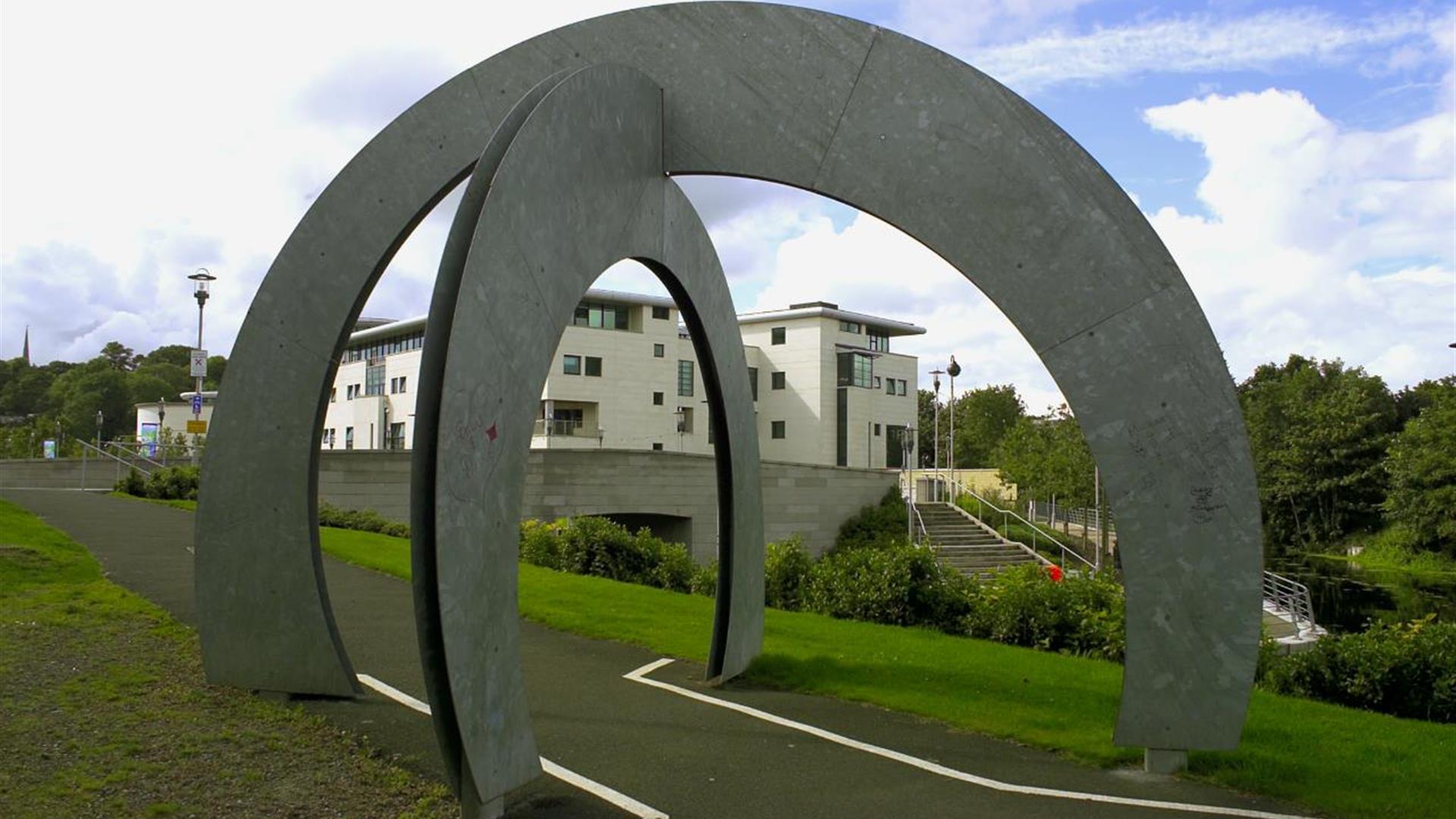 Image of the ISLAND Arts Centre through a sculpture