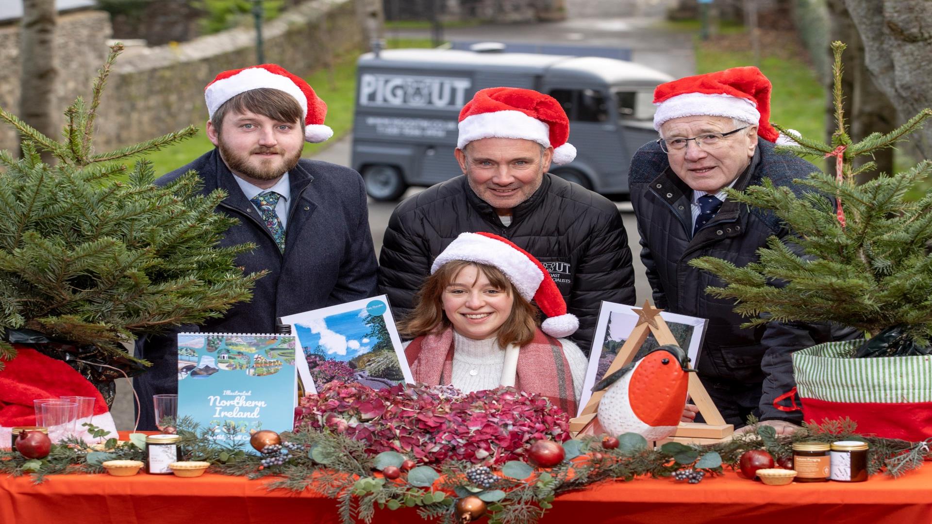 An image of Alderman Allan Ewart Chairman of the Development Committee & Councillor Aaron McIntyre Chairman of Leisure Services with traders at Royal