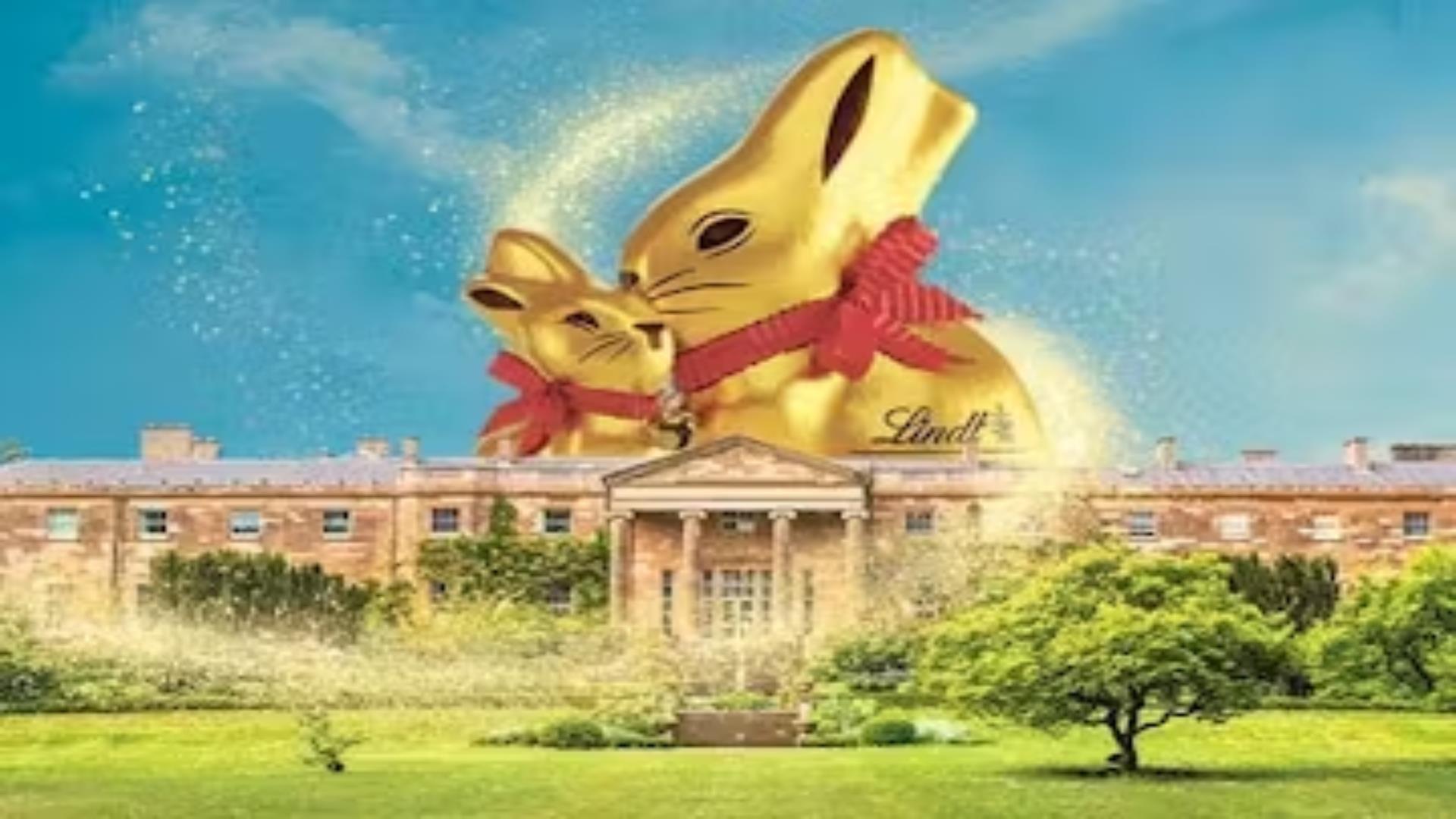 Image shows 2 giant Lindt Gold Bunny's above Hillsborough Castle and Gardens