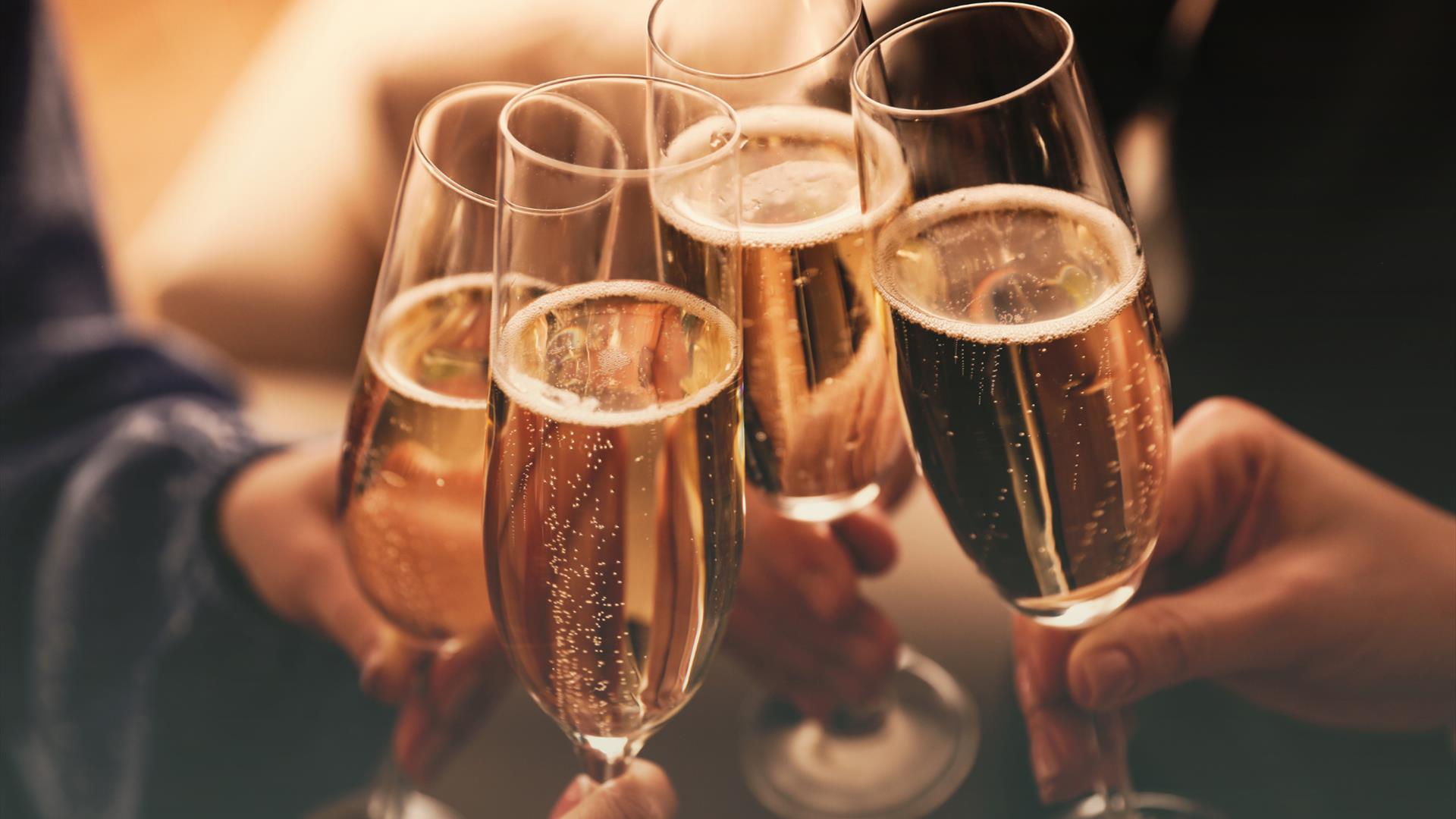 A cheers of prosecco glasses