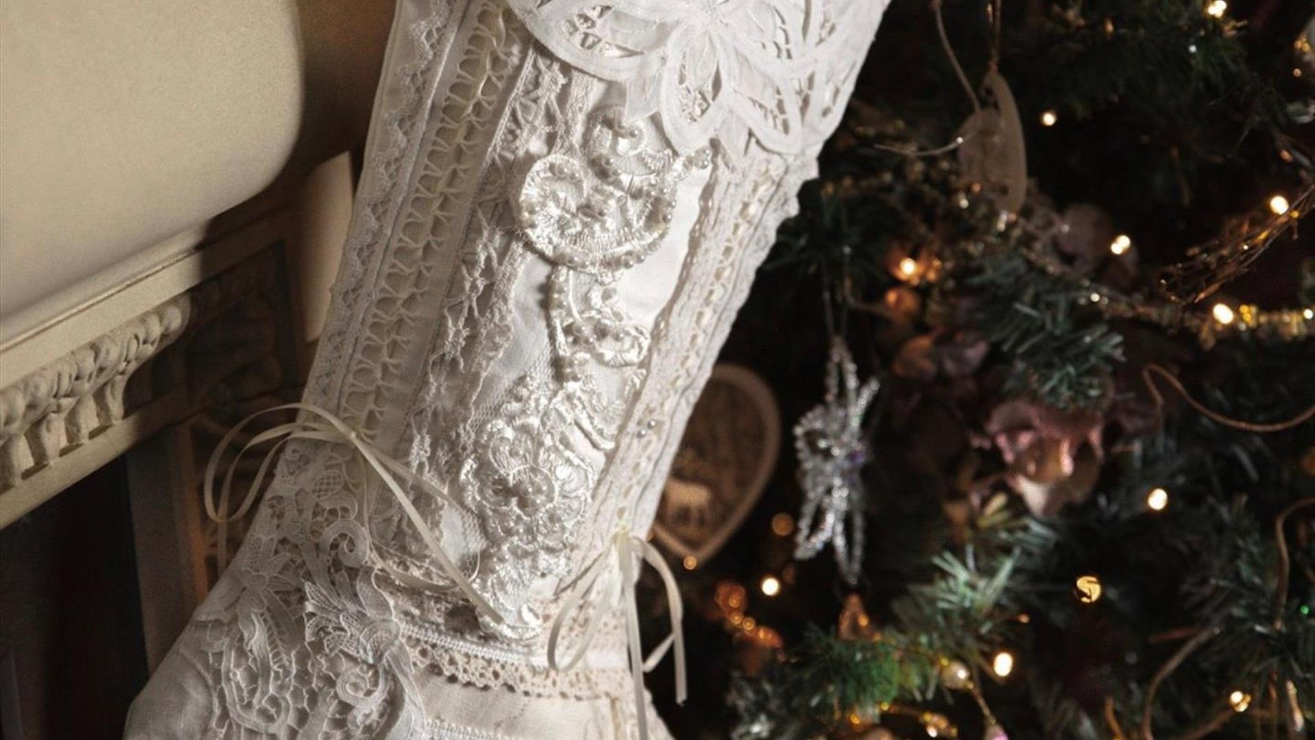 Image is of linen Christmas Stocking hung up on a tree