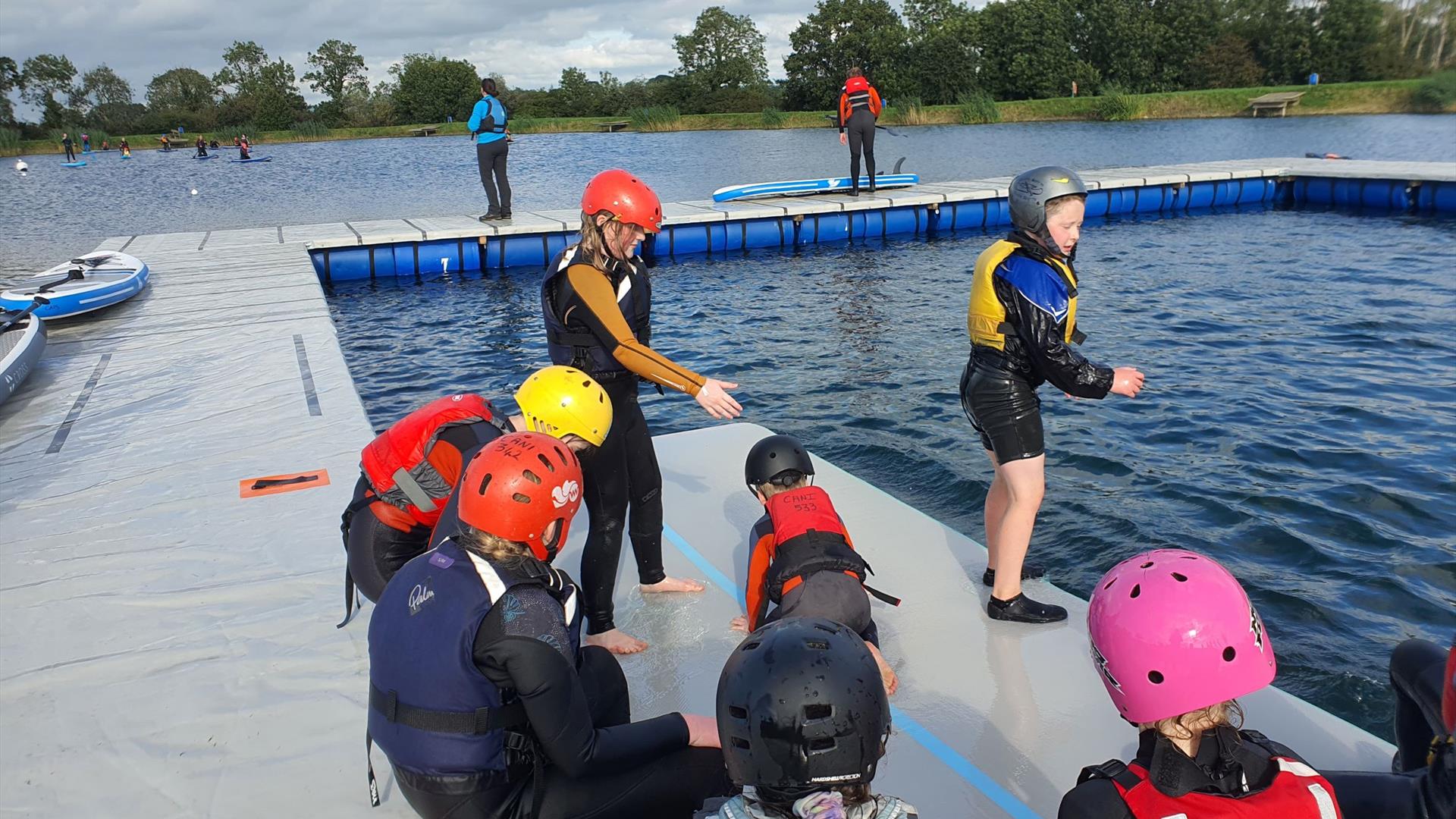 A group of children getting ready to do watersports
