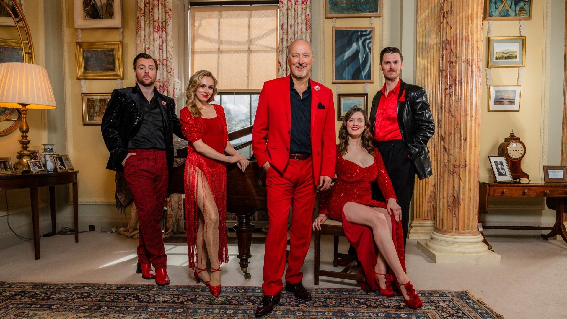 Image shows Peter Corry and fellow performers of Thank You For The Musicals 2 dressed in red.