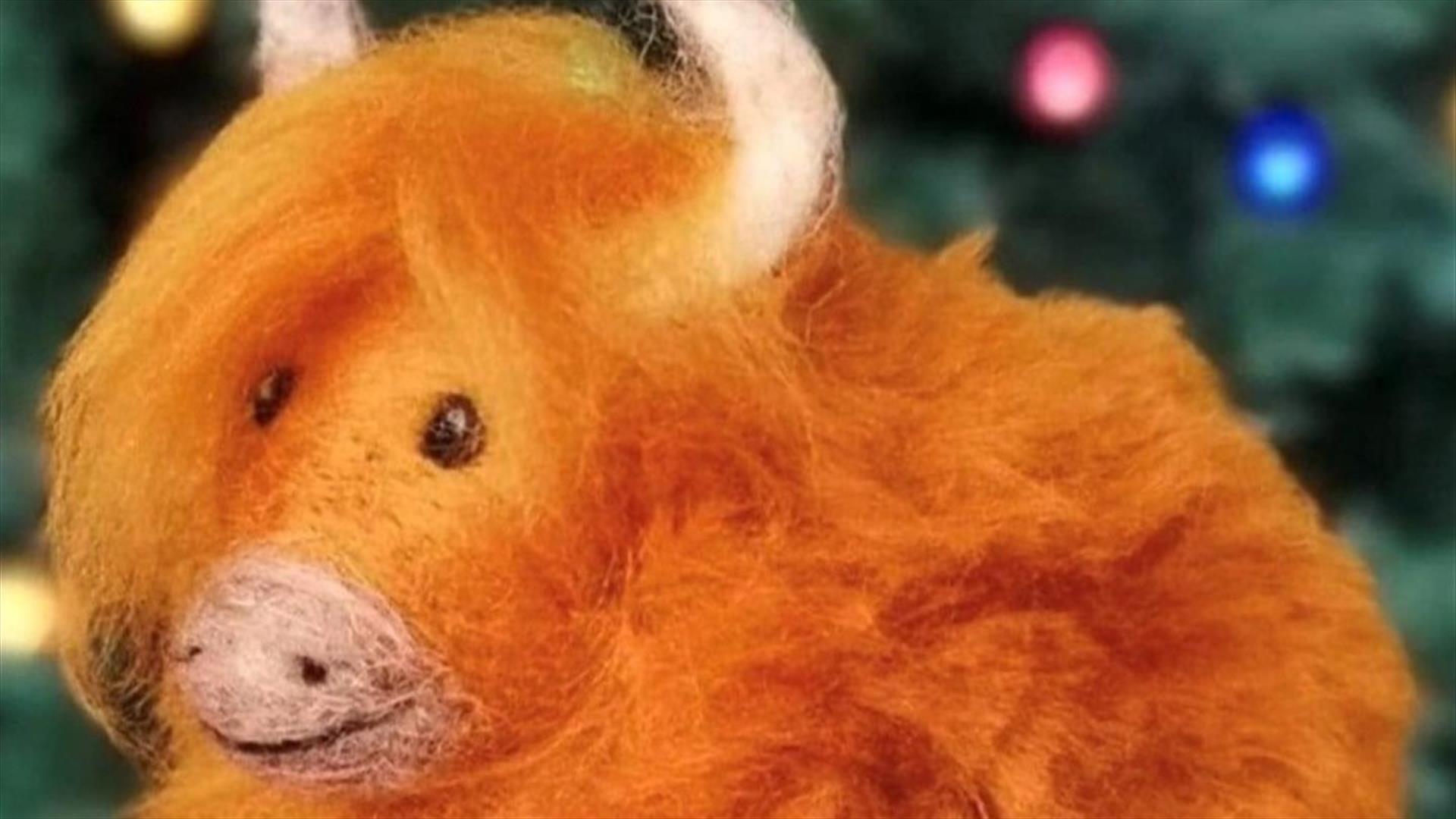A Highland Cow made by needle felting.