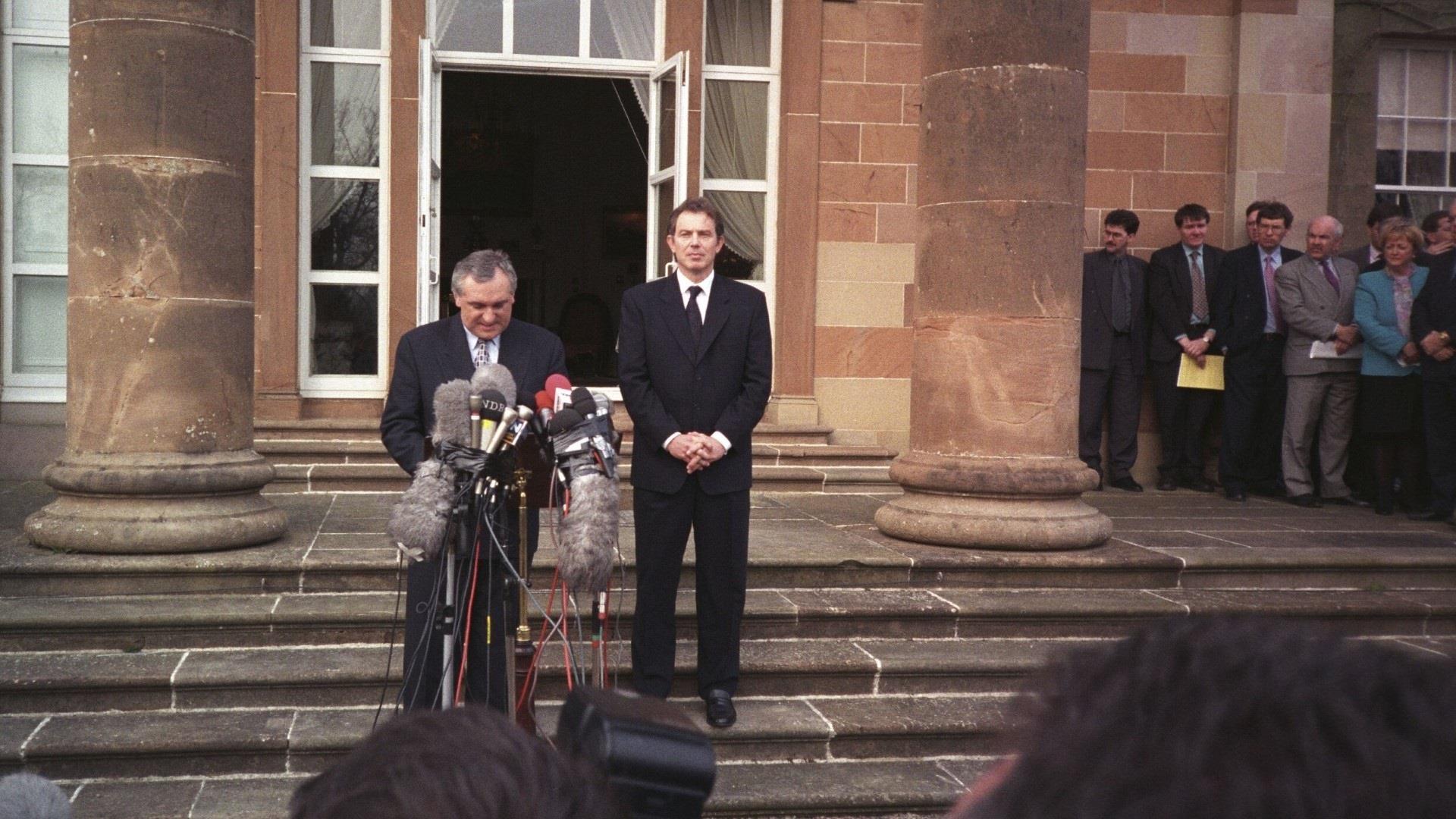 Image of Political figures speaking outside of Hillsborough Castle.