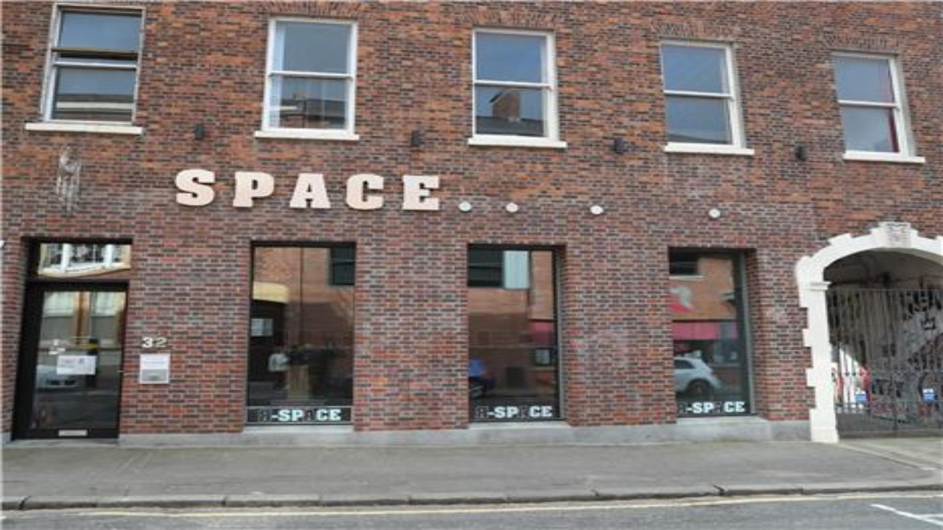 Image shows a red brick art Gallery