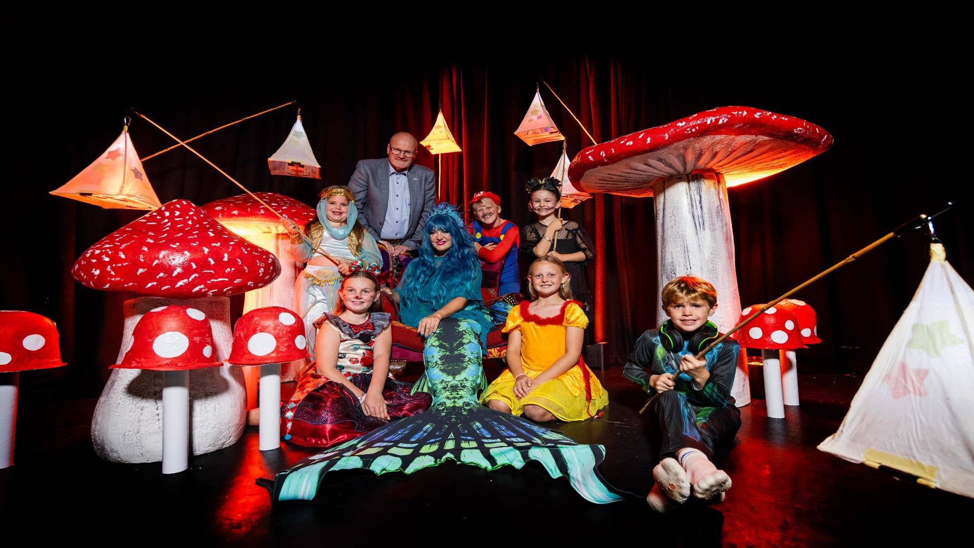 Image is of various children dressed up for Halloween