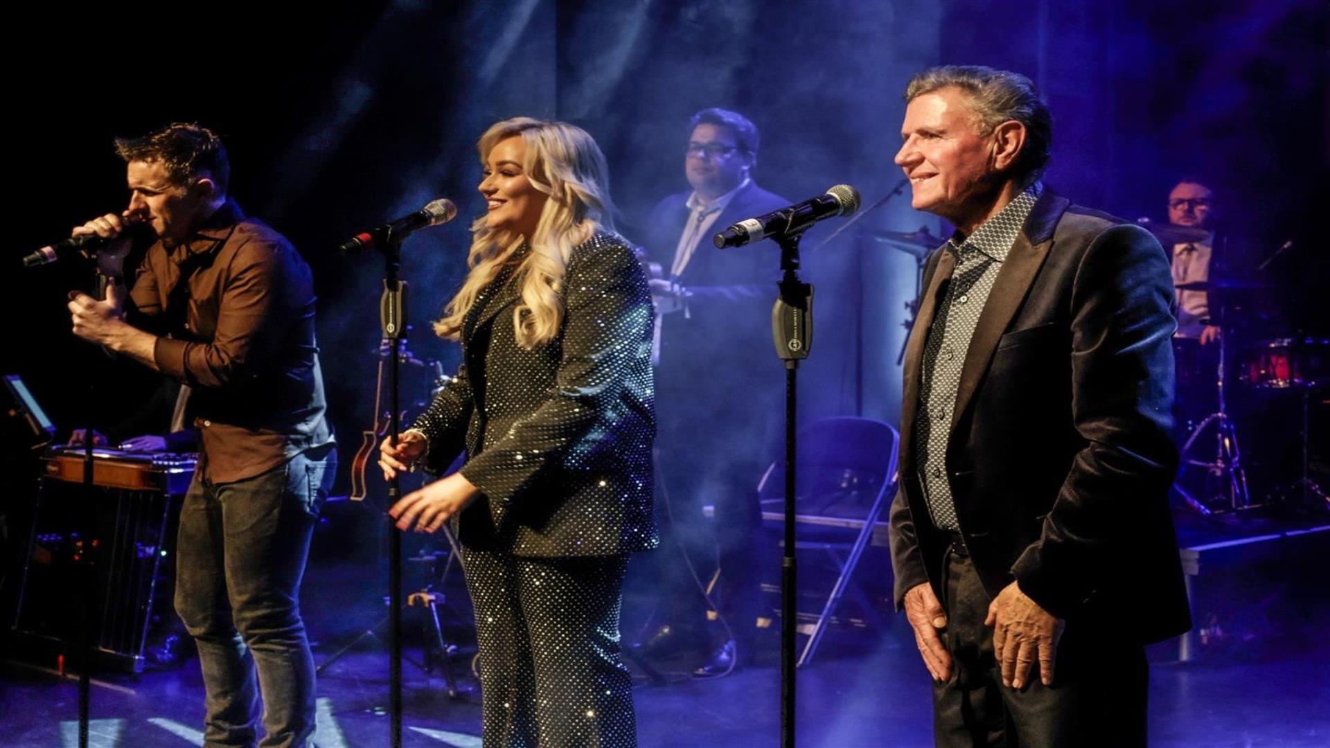 Image is of singers on stage