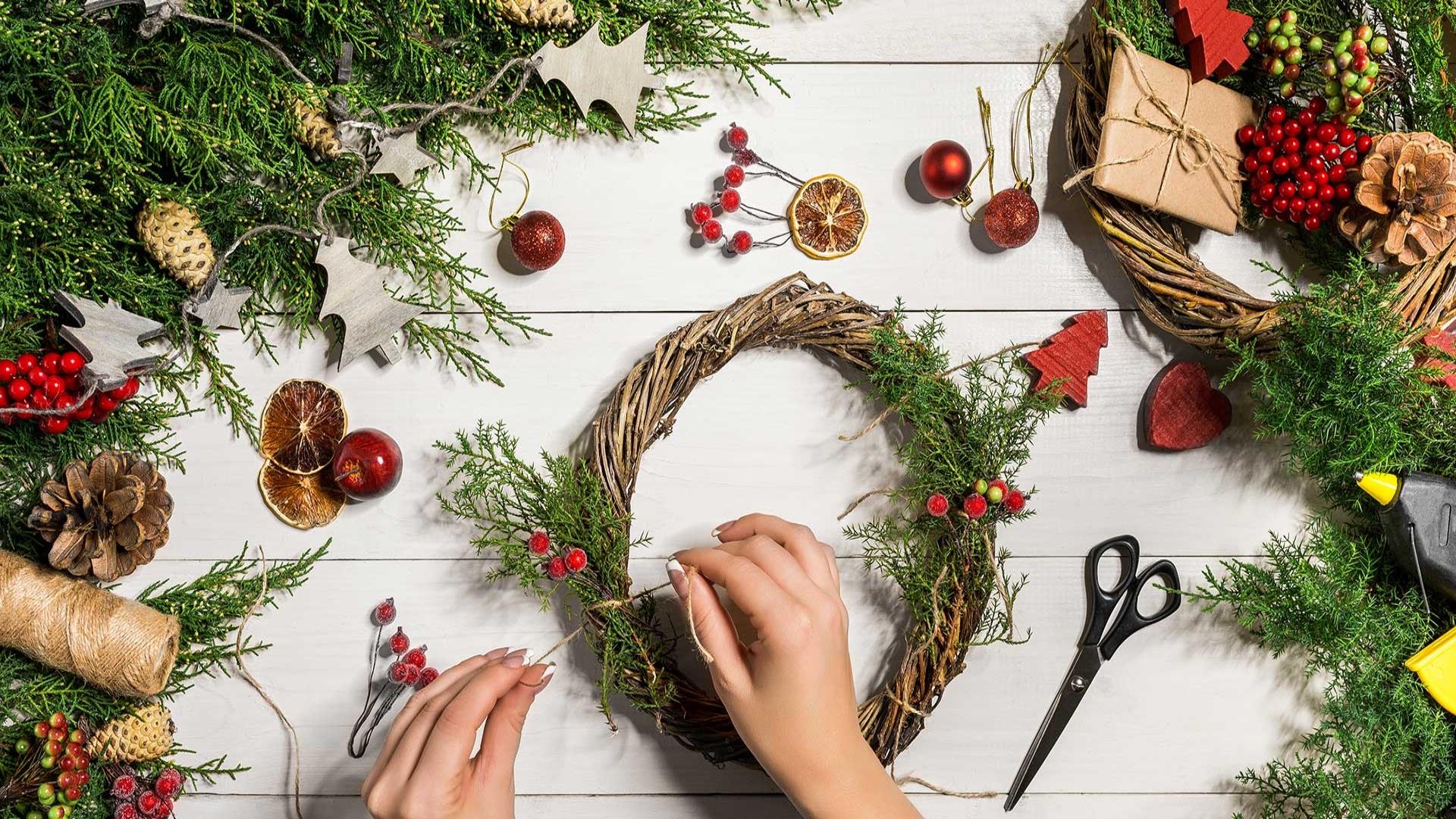 Image is of a Christmas wreath being created