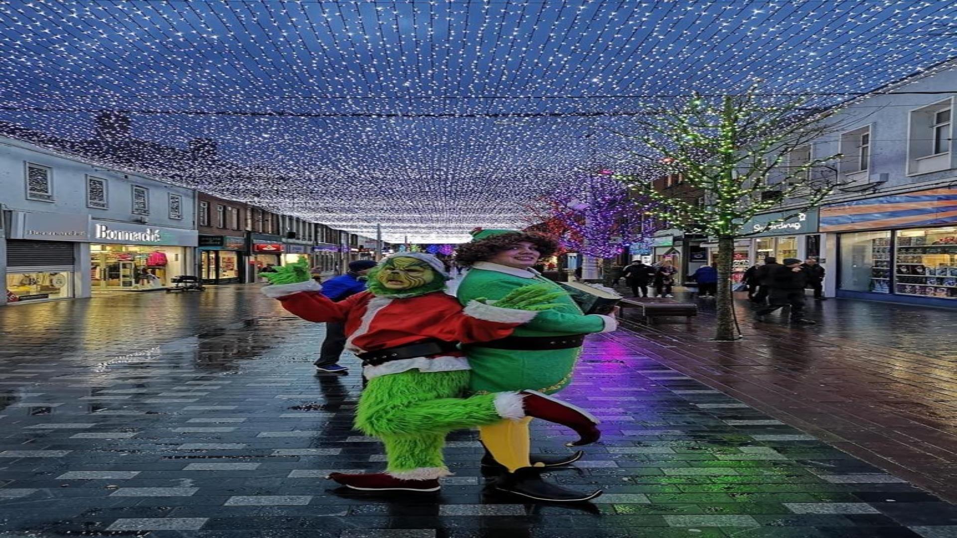 Image is of Christmas characters doing a walk about in Lisburn city centre